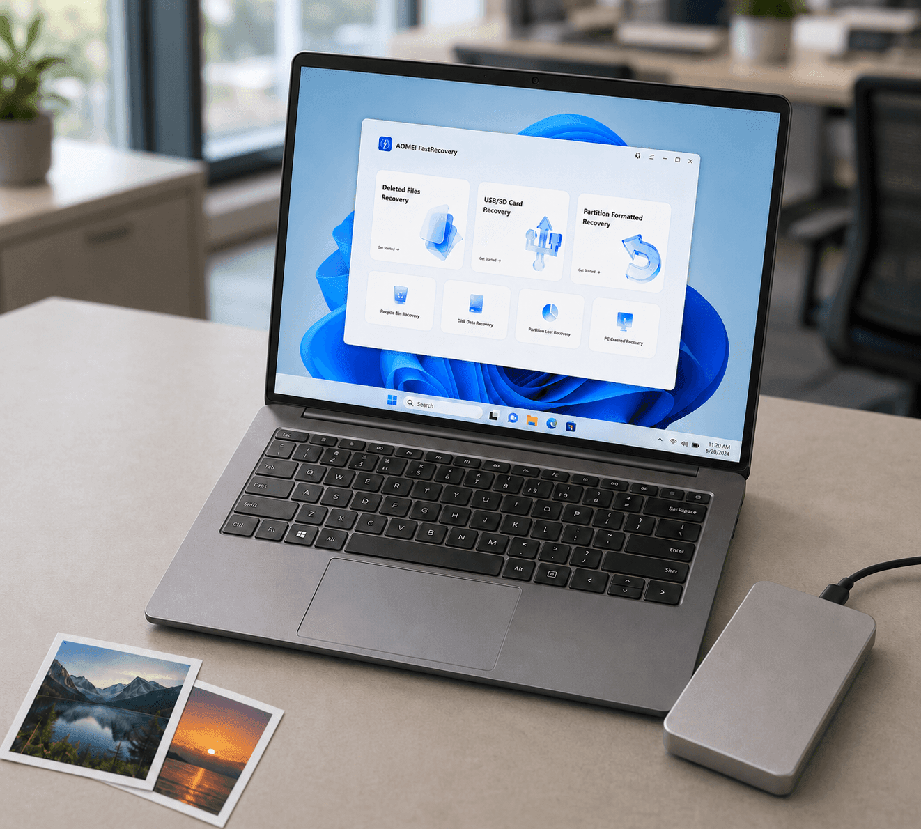 AOMEI FastRecovery su un laptop accanto a un'unità esterna